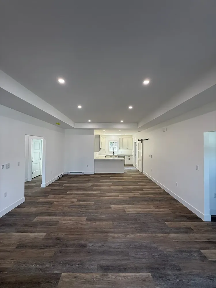 A Wildawbren finished home interior with an open-plan living area, bright natural light, and clean modern finishes